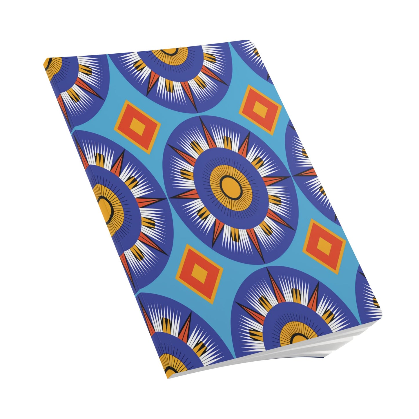 A closed African-inspired journal with a vibrant cover featuring large blue and orange concentric circular patterns and red diamond shapes set against a blue background. The edges of white pages are visible at the bottom right.