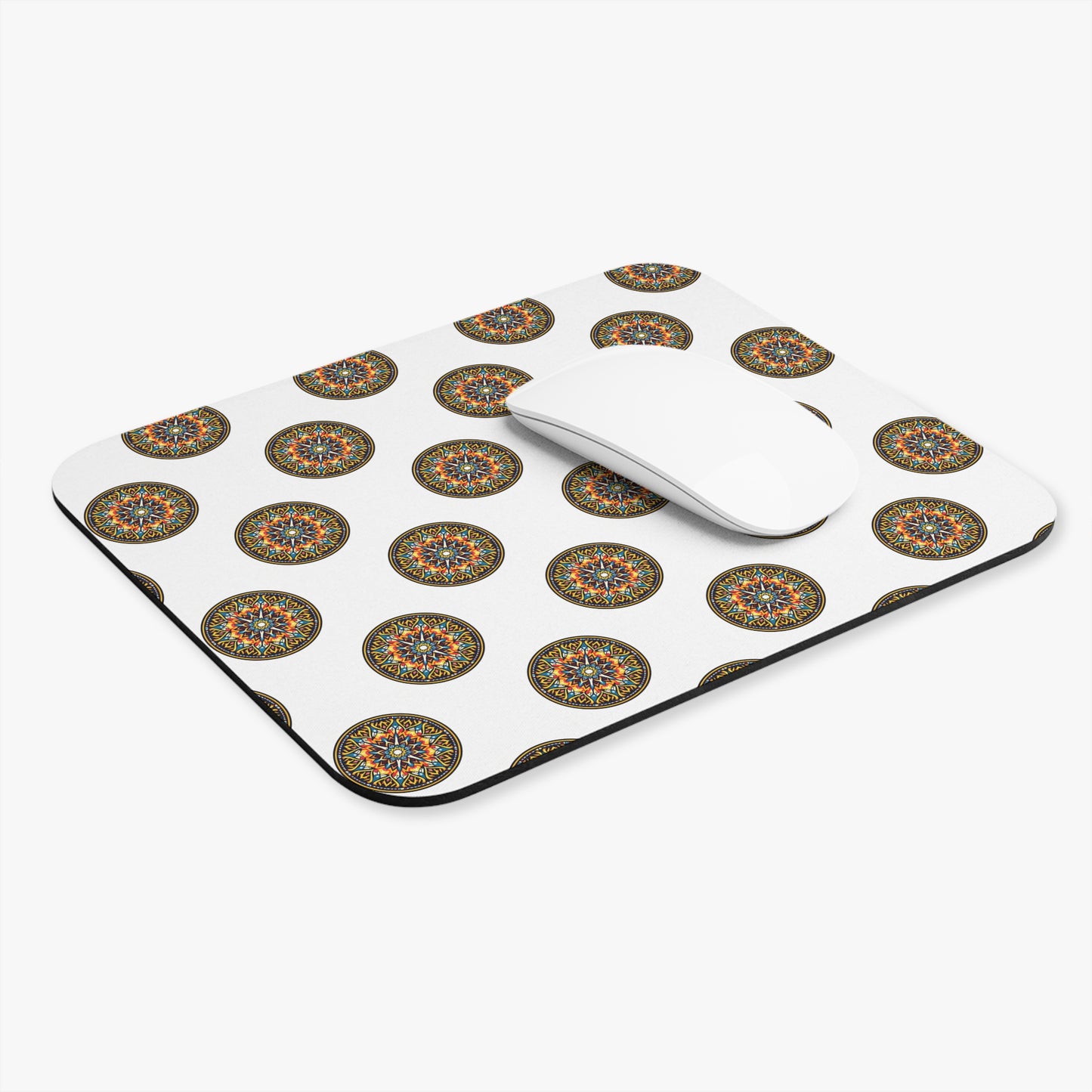 A white, non-slip mouse pad and mouse feature a repeating pattern of circular, colorful mandala designs with intricate geometric shapes. The plain white background highlights the vibrant mandalas, making this a striking and vibrant desk accessory.