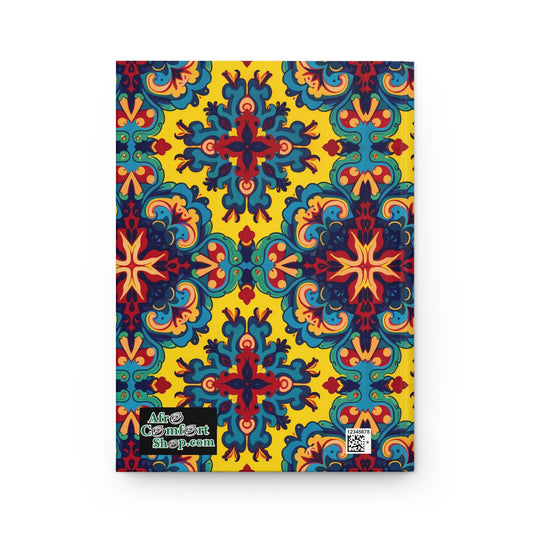 A colorful, symmetrical pattern featuring blue, red, and orange floral and starburst shapes on a bright yellow background decorates this African-inspired hardcover journal. A small logo and QR code are visible in the lower left corner.