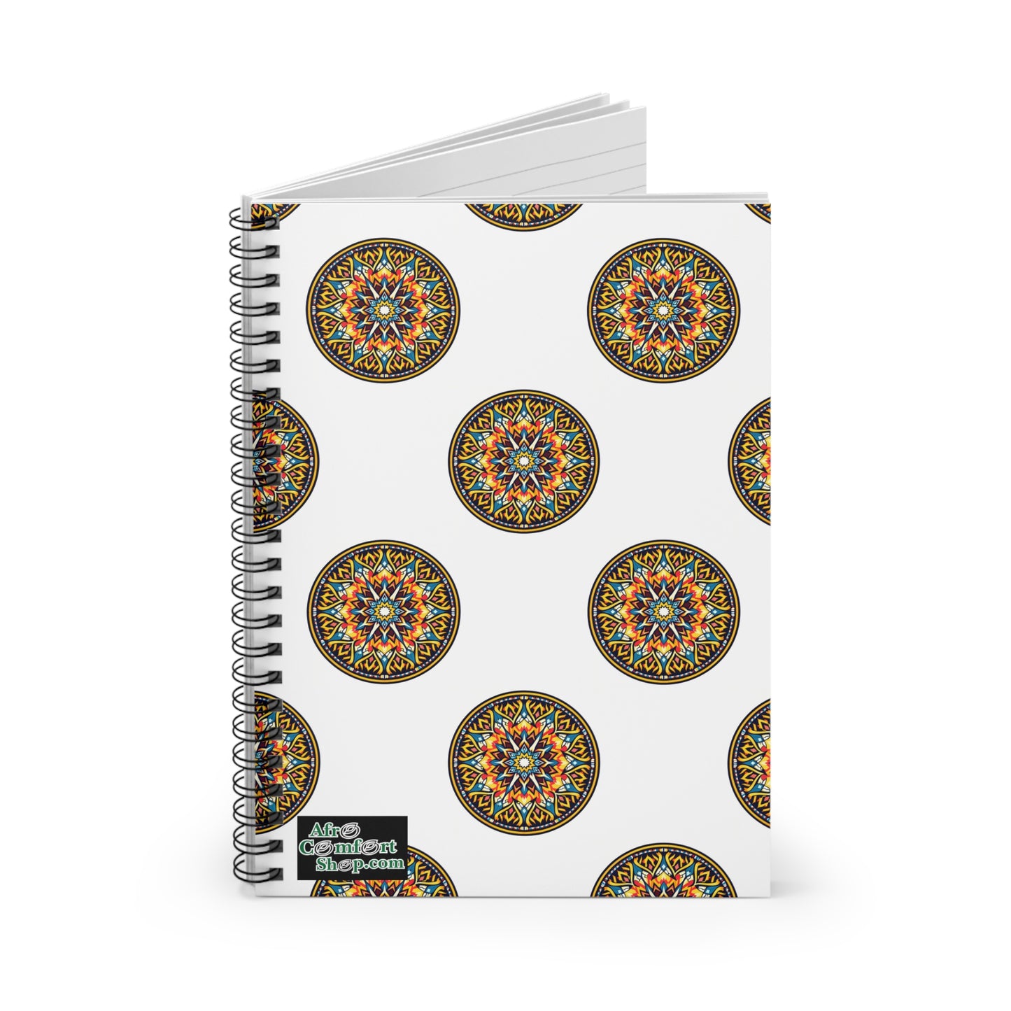A spiral notebook with a white cover featuring vibrant, intricate mandala designs inspired by African art. The bottom left corner has a small label with “Afro Continent Shop.” The notebook is slightly open, revealing lined pages inside.