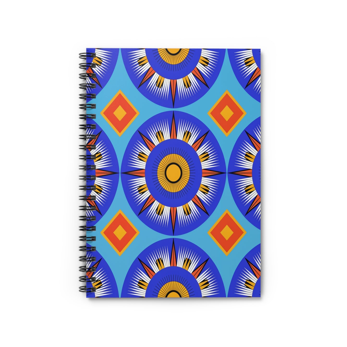 A spiral-bound notebook with a vibrant, African-inspired cover featuring blue circular sunburst shapes, yellow centers, and white rays, accented by orange and red diamonds—all set against a bright blue background for a premium writing experience.