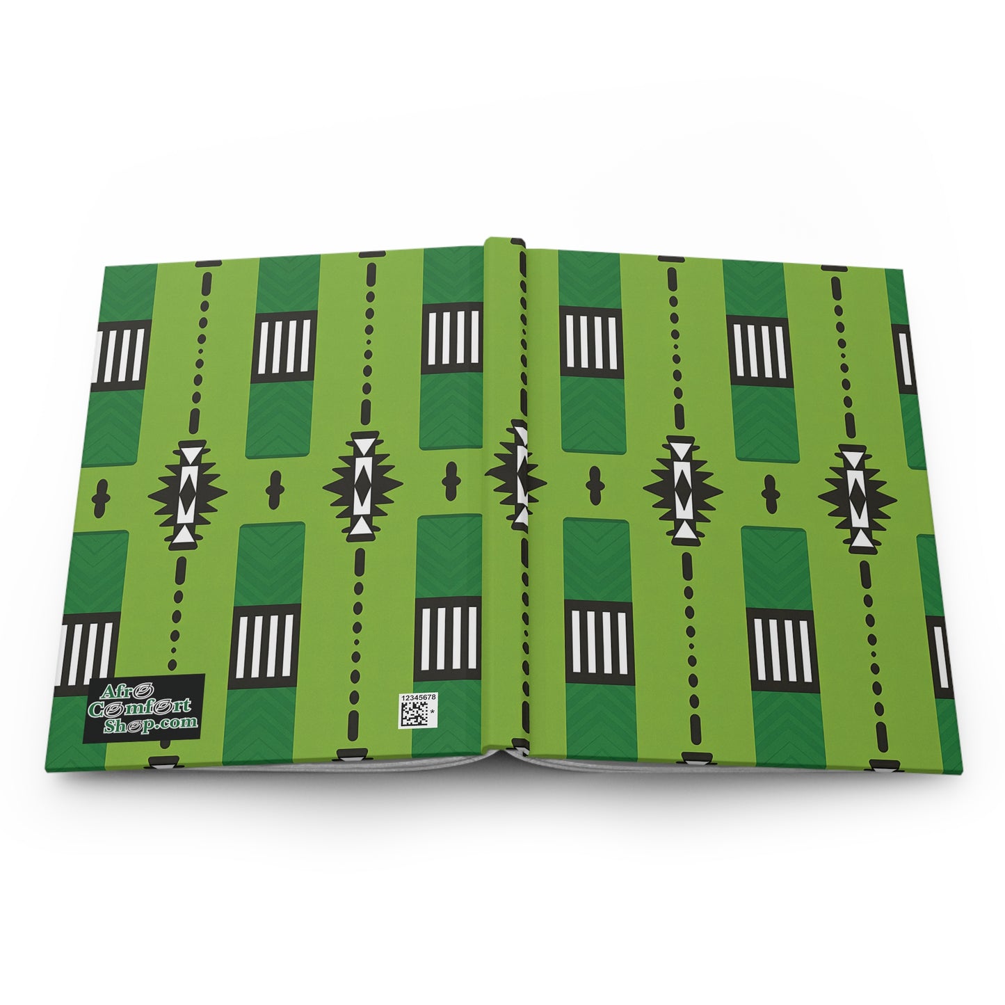 An open African-inspired hardcover journal with a green cover featuring a geometric pattern of black, white, and green shapes. The bottom left corner has a black label with white text and a QR code beneath it.