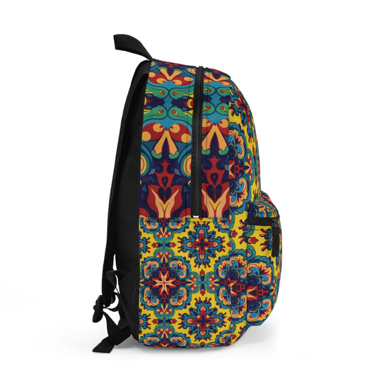 A side view of an African-inspired backpack featuring a vibrant, ornate floral and geometric pattern in blue, red, yellow, and green. This boho chic rucksack has black straps, a zipper, and a front pocket with the same colorful design on a plain white background.