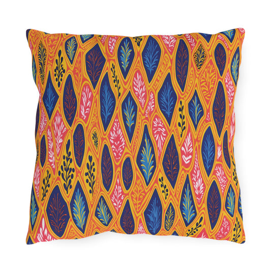 A square throw pillow with an African-inspired, bright multicolored pattern of leaf shapes in blue, pink, and orange on a yellow background. Each leaf contains a stylized branch or vine for a vibrant, overlapping design. Edges are slightly curved.