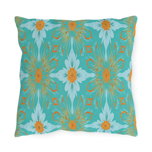 A rectangular pillow with a turquoise background features an African-inspired, symmetrical floral pattern in shades of orange, white, and light blue, resembling stylized daisies. The repeating design creates a vibrant, decorative look.