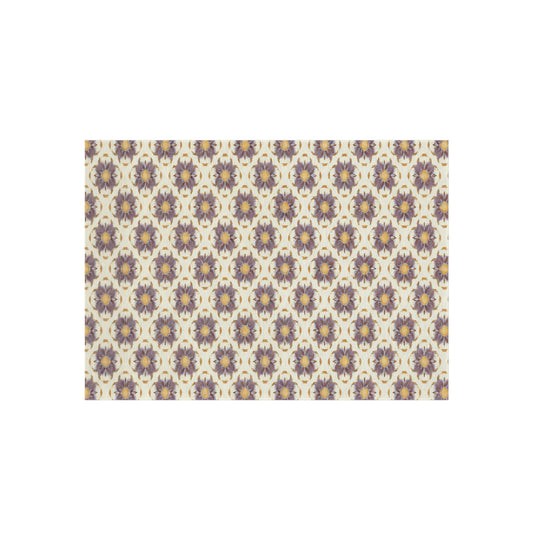 A repeating pattern with stylized, symmetrical floral shapes in purple and beige, each featuring a small yellow circle at the center, set against a light cream background. The African-inspired design creates a vintage, ornamental look with a consistent, geometric arrangement.