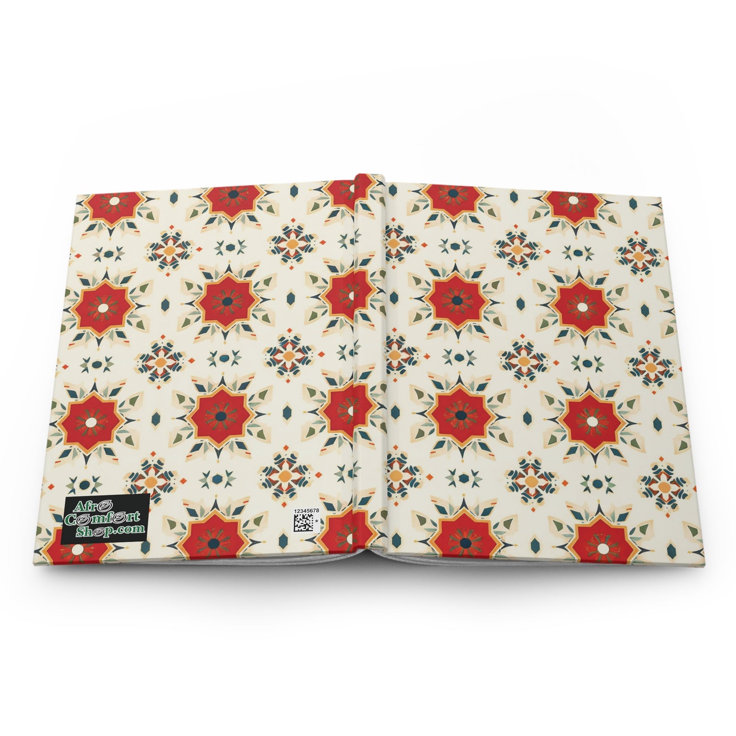 A hardcover journal is shown open, featuring a cover with a repeating geometric pattern of red and orange star shapes and blue accents on a cream background. A small black label reads Alice Coltrane blue-paint in white text on the front cover’s bottom left.