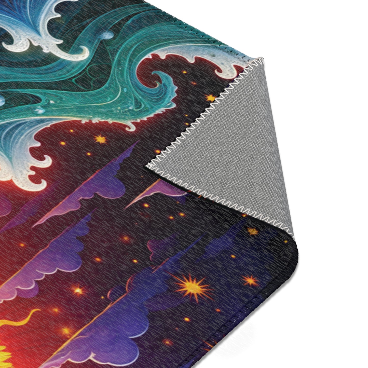 A close-up of a rectangular fabric with zigzag-stitched edges. The design, inspired by African design rugs, features swirling teal waves, purple mountains, yellow stars, and a red-orange sunset gradient. One corner is folded over to reveal a plain gray underside.