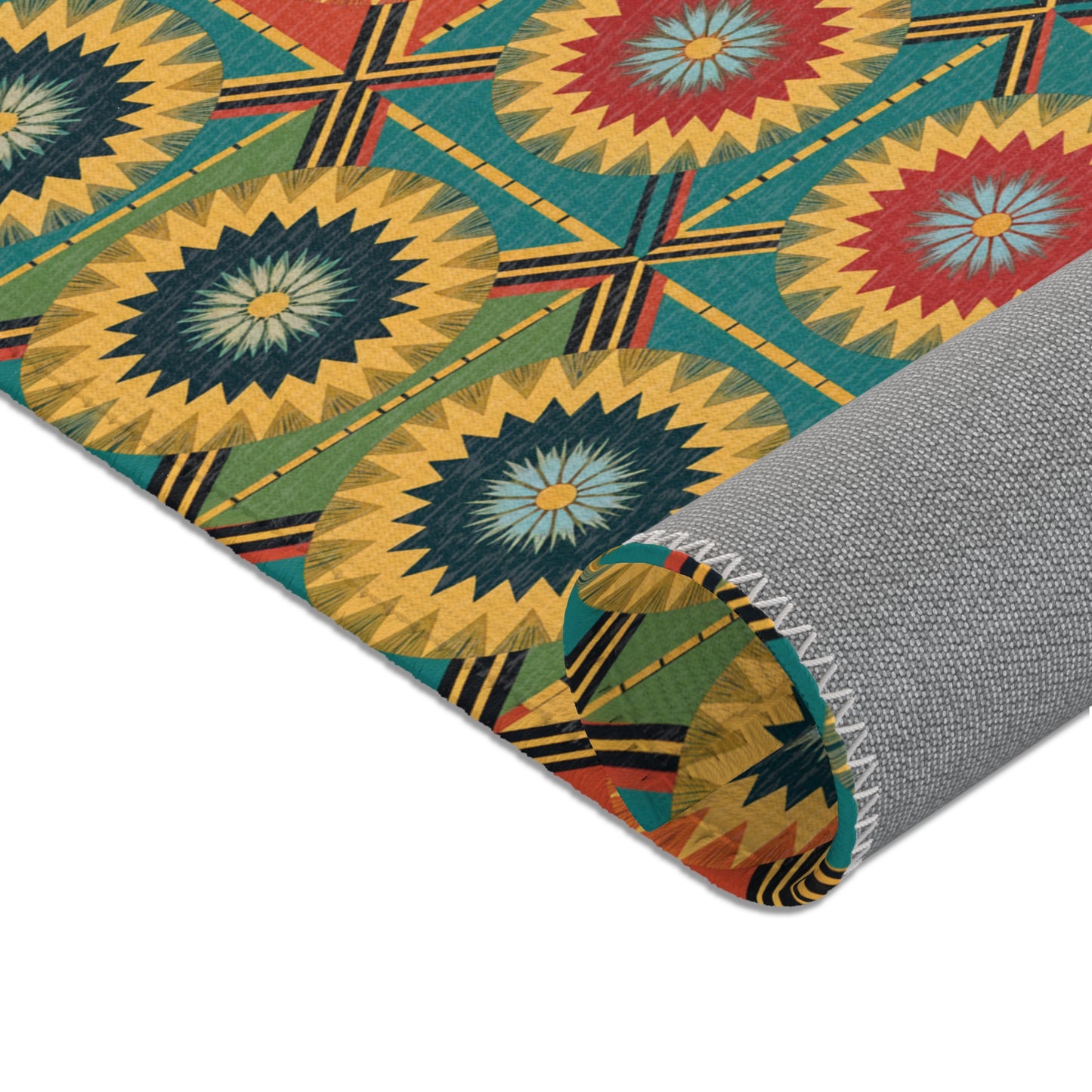 A rolled-up rug with a vibrant geometric pattern of radiating starburst shapes in yellow, red, blue, and green. The gray textured backing and zigzag stitching highlight the durable polyester rug—perfect for stylish home decor.