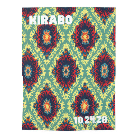A square poster with “KIRABO” in bold white letters at the top left and “10.24.28” in white at the bottom right. The African-inspired decor features a repeating geometric floral pattern in red, navy, and yellow-green diamond shapes.