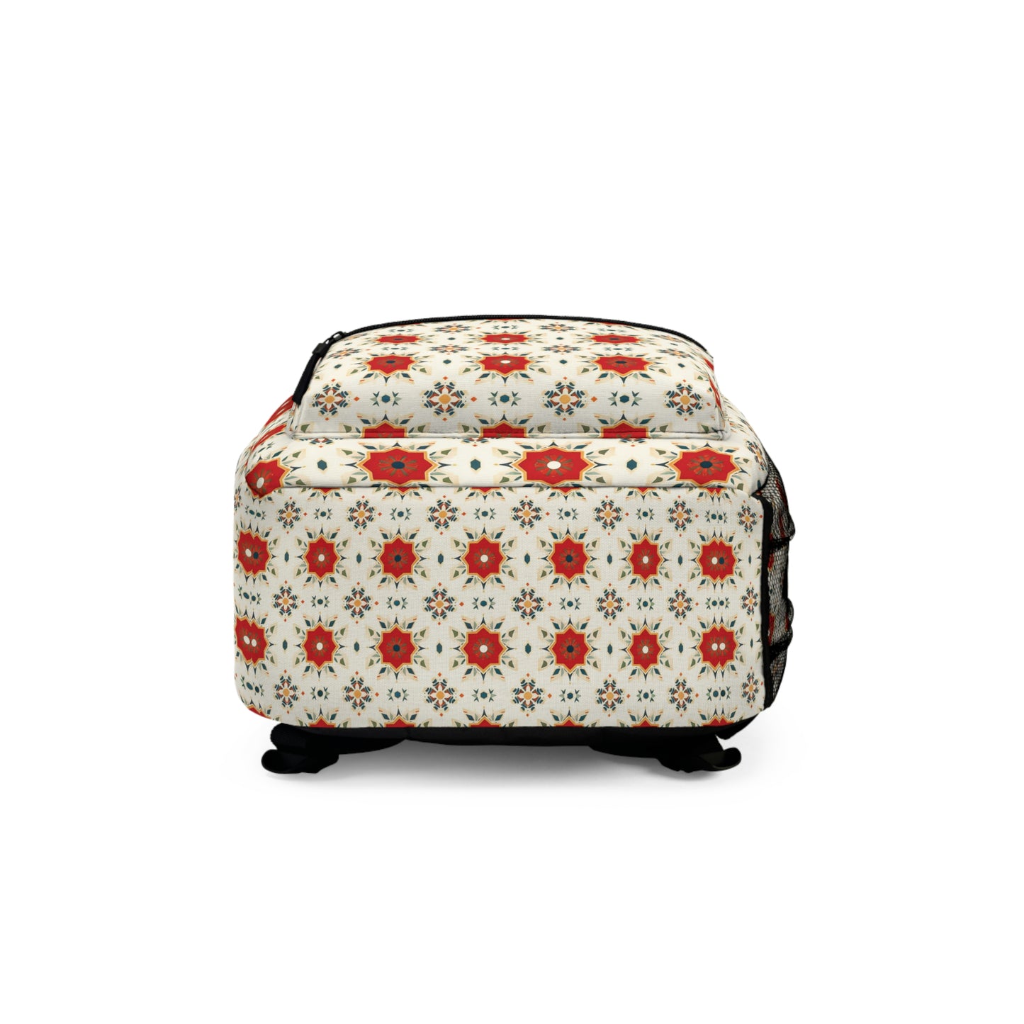 A square ottoman with a cream background features vibrant patterns in a red and white floral design. Supported by four short black legs, this piece brings a bold touch to any room and is shown against a plain white background.