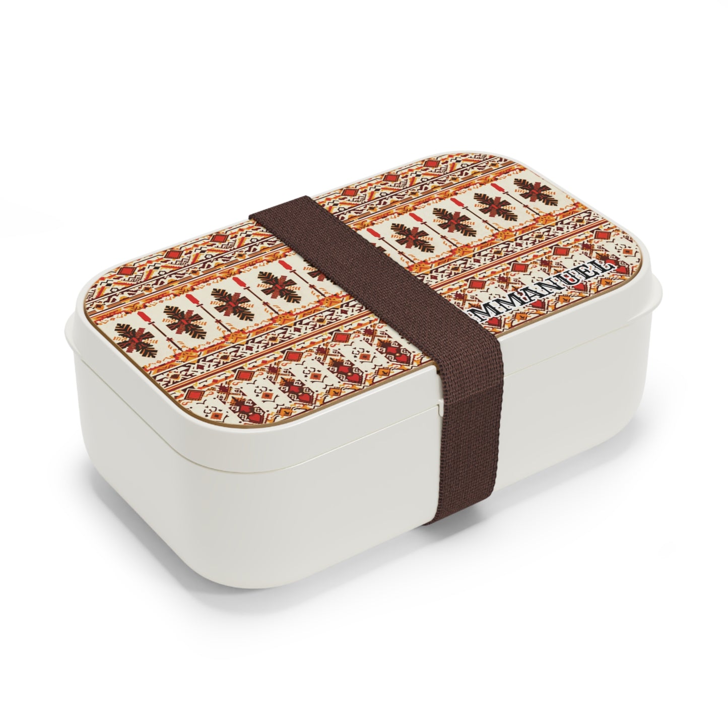 A rectangular white, BPA-free lunchbox with a lid featuring a colorful, intricate, folk-inspired geometric pattern in red, orange, and beige. This African-inspired bento lunch box is secured with a wide, dark brown elastic band around its middle.