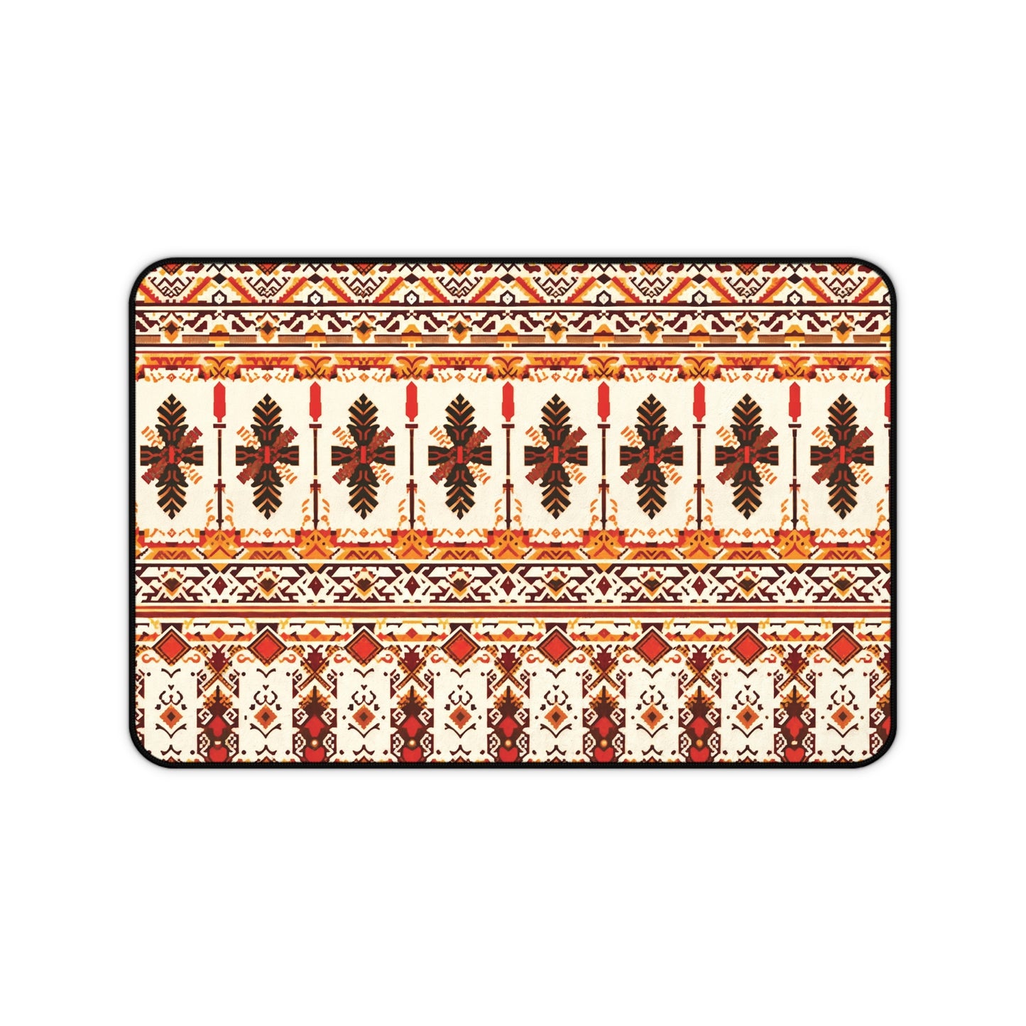 A rectangular neoprene desk mat features a symmetrical, intricate folk-inspired pattern in red, orange, brown, and yellow on a cream background, with repeating rows of stylized leaves and geometric shapes, bordered by a thin black outline.