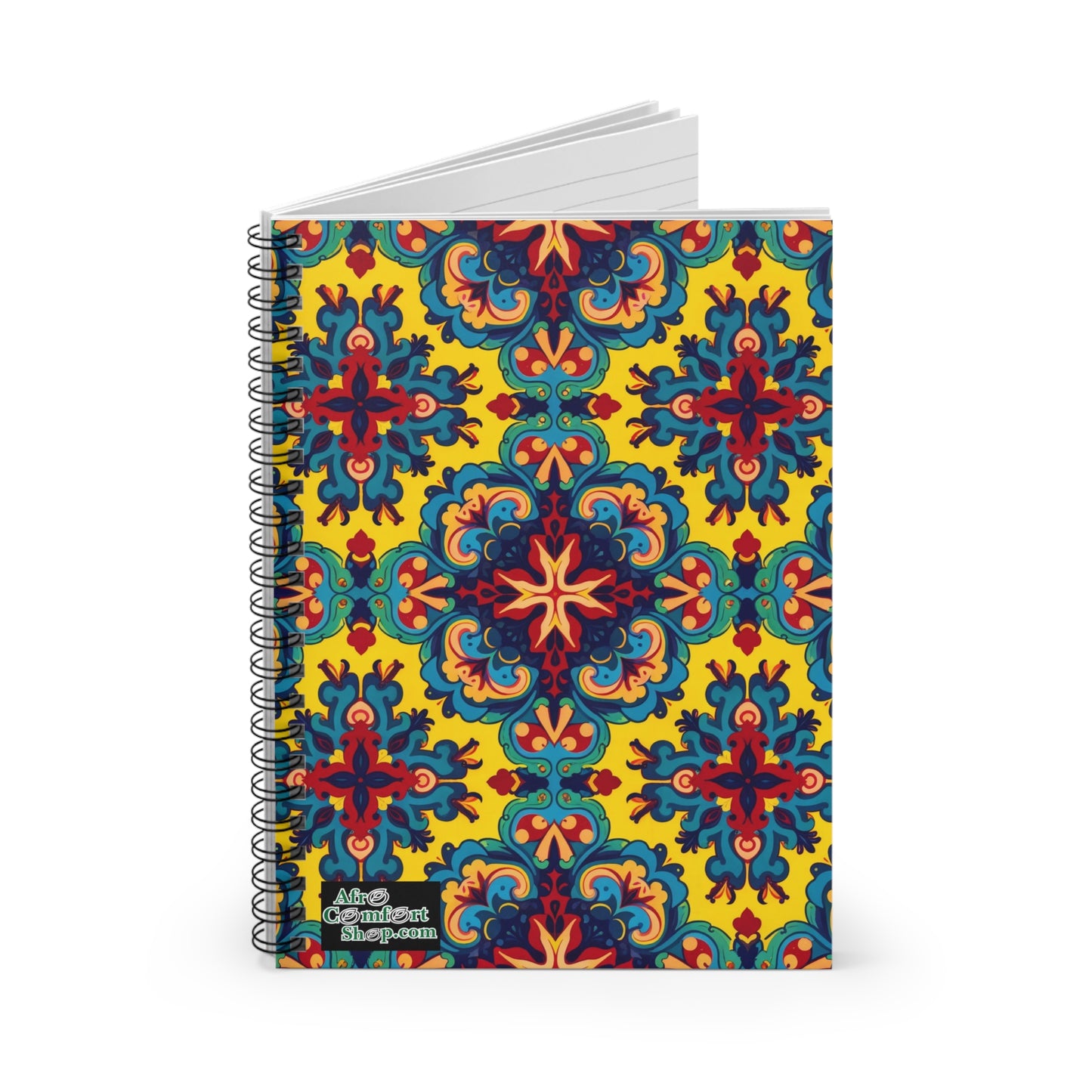 A premium writing journal with a vibrant cover featuring an intricate, symmetrical pattern in red, blue, green, and orange on a yellow background. The African-inspired spiral notebook has a small Artsy Gradient Shop.com label at the bottom left corner.