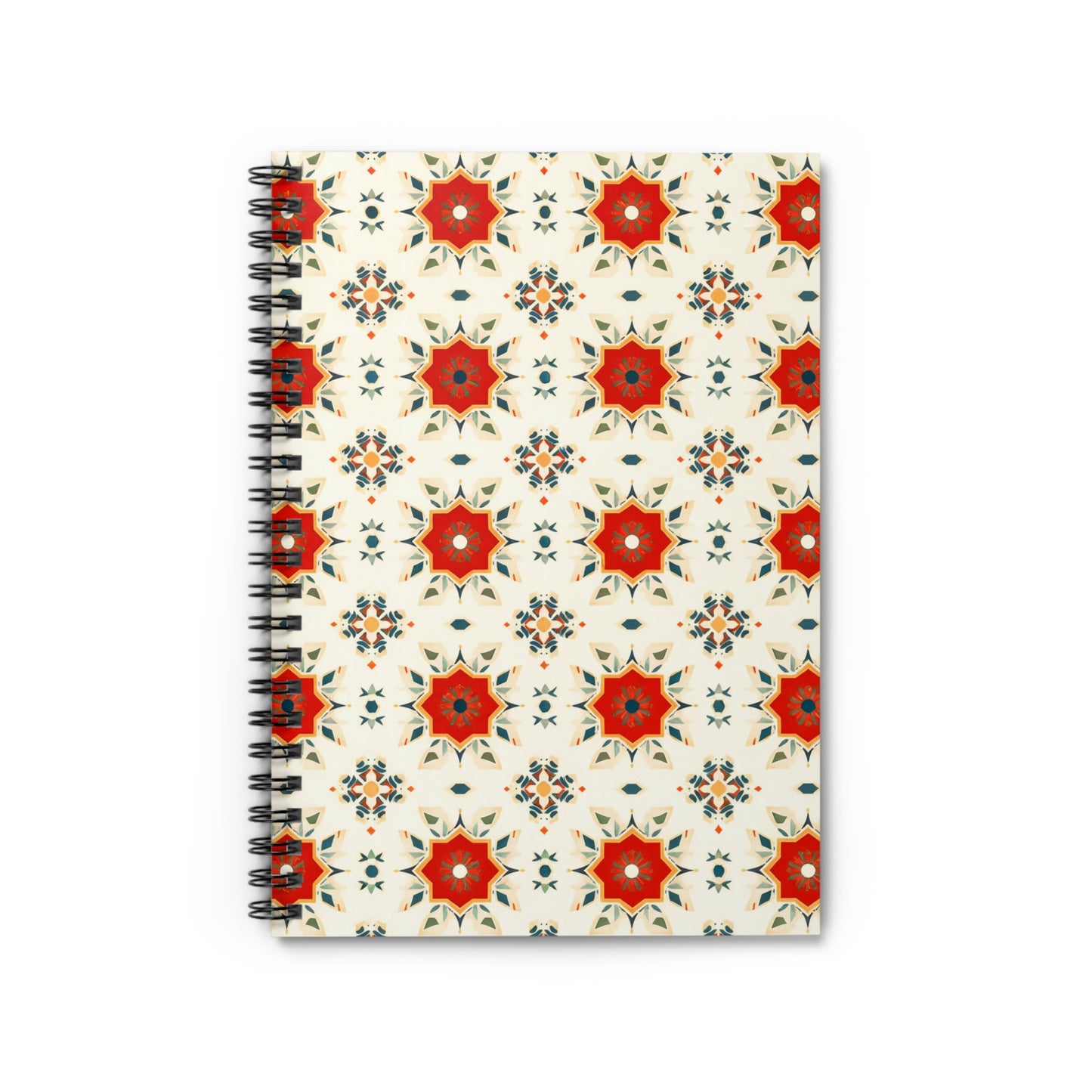 A spiral-bound African-inspired spiral notebook with a glossy cover featuring red, orange, and green geometric star shapes on a cream background. The culturally inspired design is photographed from above on a white surface.