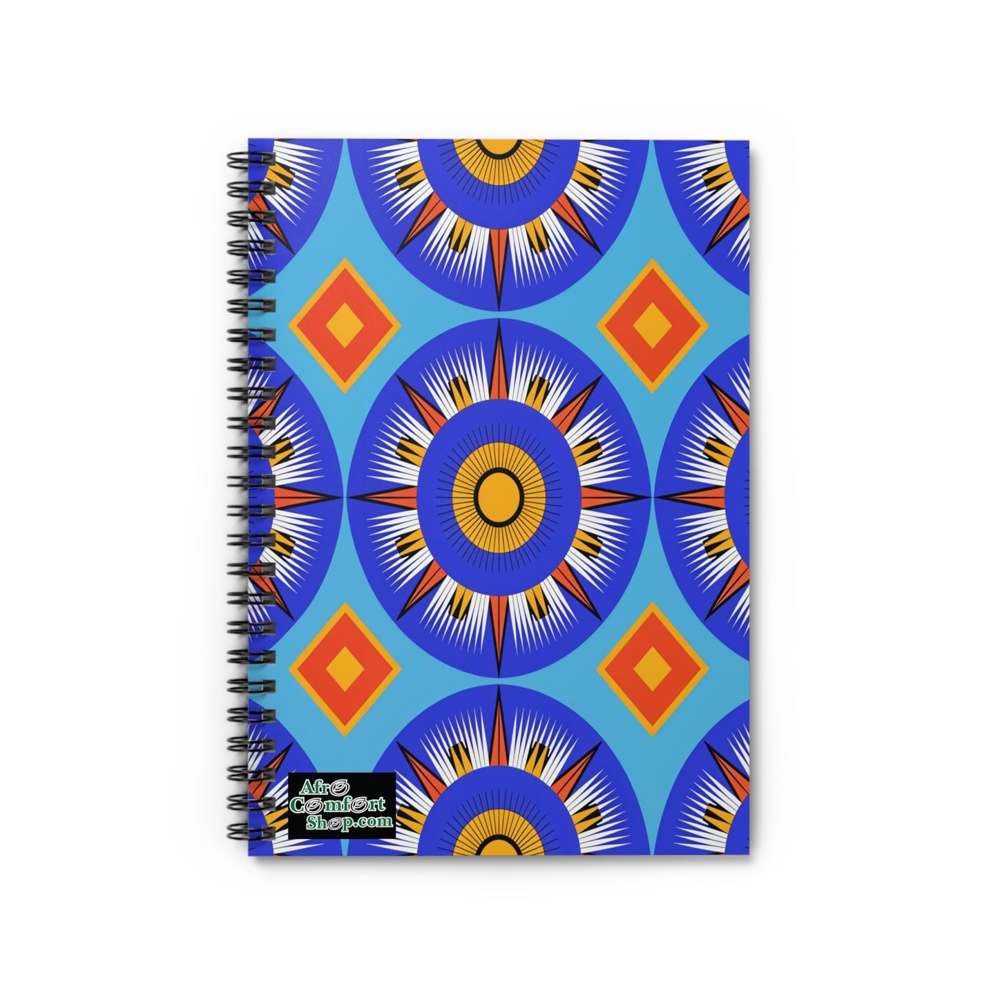 A spiral notebook with a vibrant, geometric cover featuring large blue and orange circular starburst patterns, radiating lines, and orange diamonds on a light blue background. Enjoy a premium writing experience with culturally inspired designs.