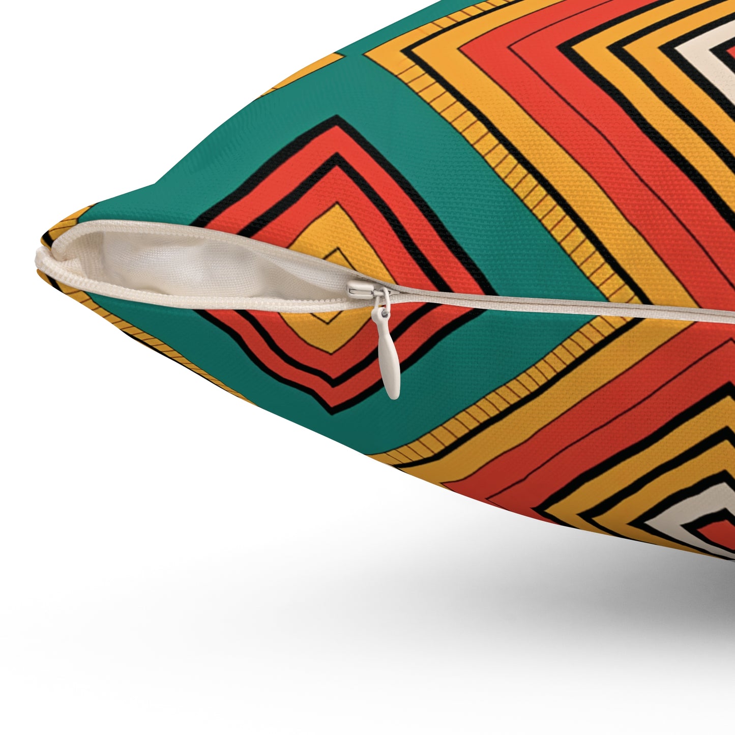 Close-up of a pillow with a white zipper partially open. Featuring vibrant patterns of concentric squares in red, yellow, orange, and black on green, this African-inspired pillow adds unique decor to any space. The fabric’s texture is clearly visible.