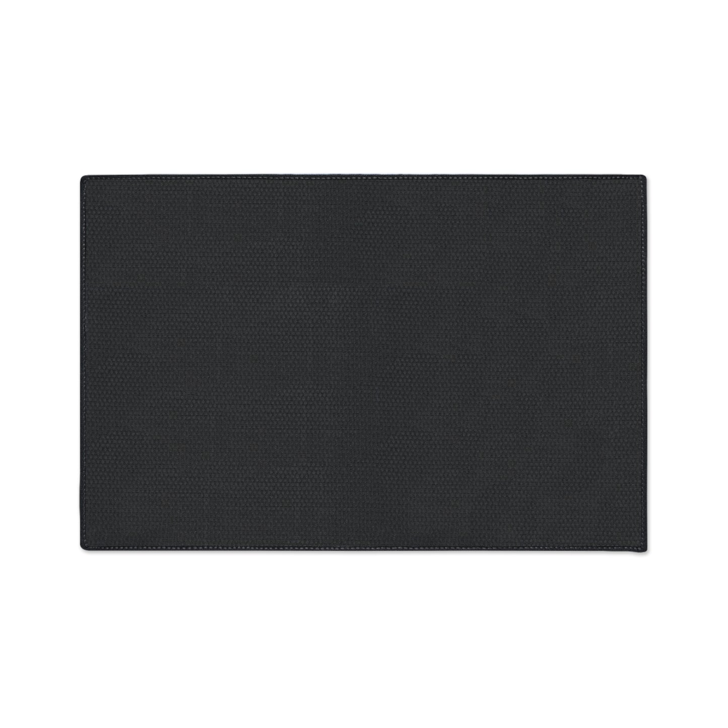 A rectangular, flat black non-slip rug with subtle textured patterns is centered on a white background. The edges are neatly stitched, and its surface appears smooth and even. The mat has no visible designs or logos.