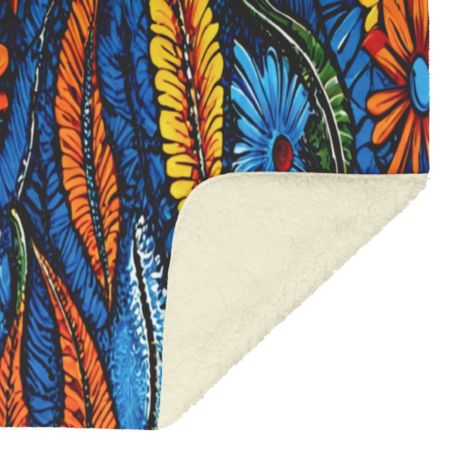 A corner of a blanket is folded to reveal its soft, cream-colored fleece underside. The top side features a vibrant, African-inspired abstract floral pattern with blue, orange, and yellow hues and bold leaf shapes outlined in black.