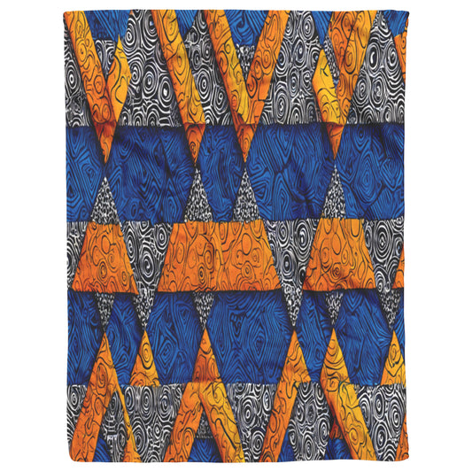 A vibrant, African-inspired textile pattern features rows of geometric triangles in blue, orange, yellow, and black-and-white. The triangles are filled with swirling, textured designs, creating a bold and dynamic abstract composition.