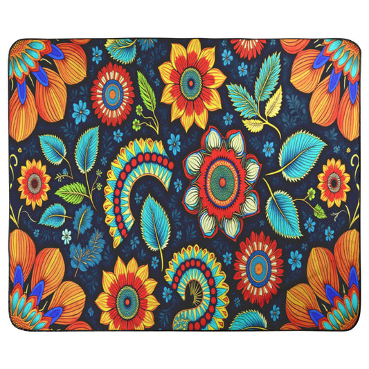 A rectangular mat with a vibrant floral pattern and African-inspired patterns. Large orange, red, and yellow flowers with blue-green leaves are set against navy, creating a colorful, symmetrical, and ornate look.