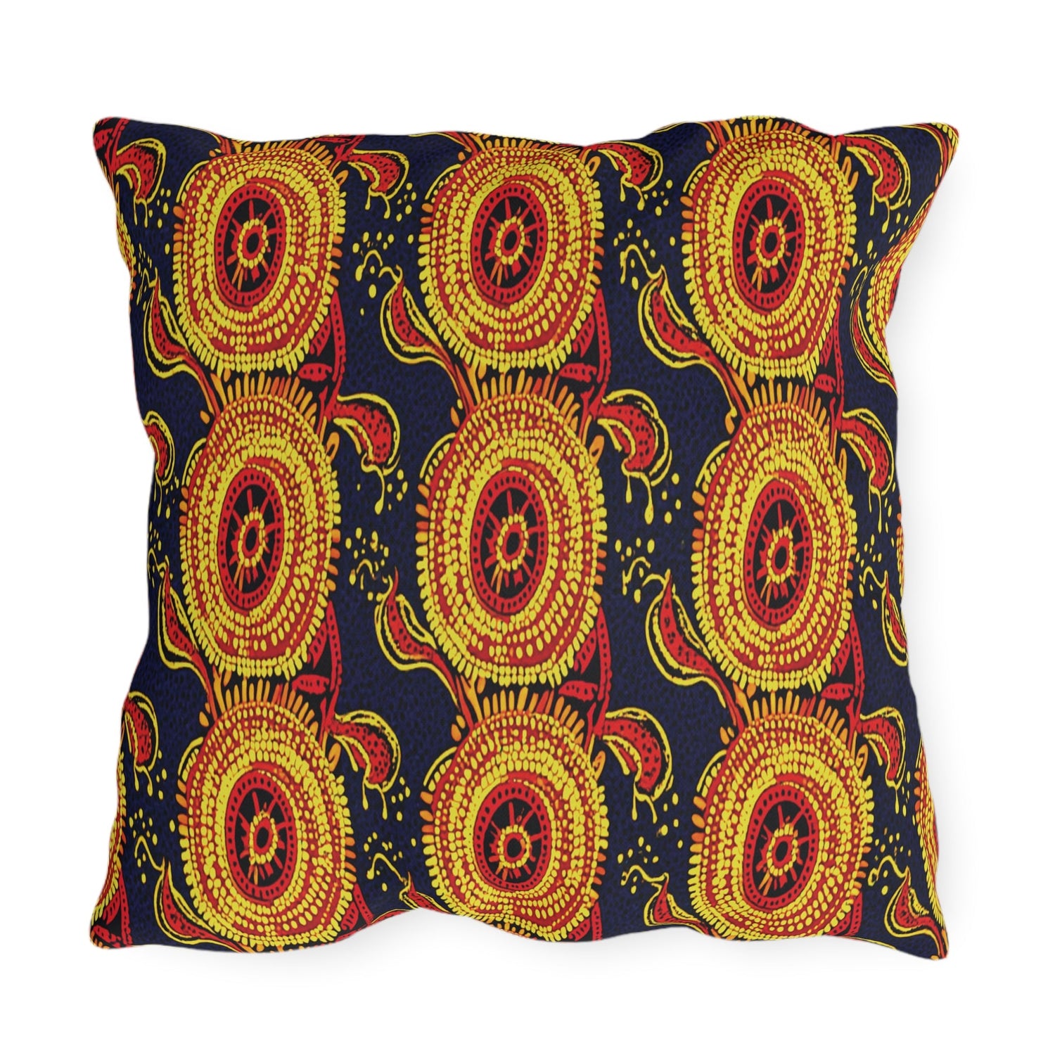 Rectangular pillow with a bold pattern of concentric yellow and red circles with radiating lines and swirl details on a dark blue background. The design is vibrant and symmetrical.