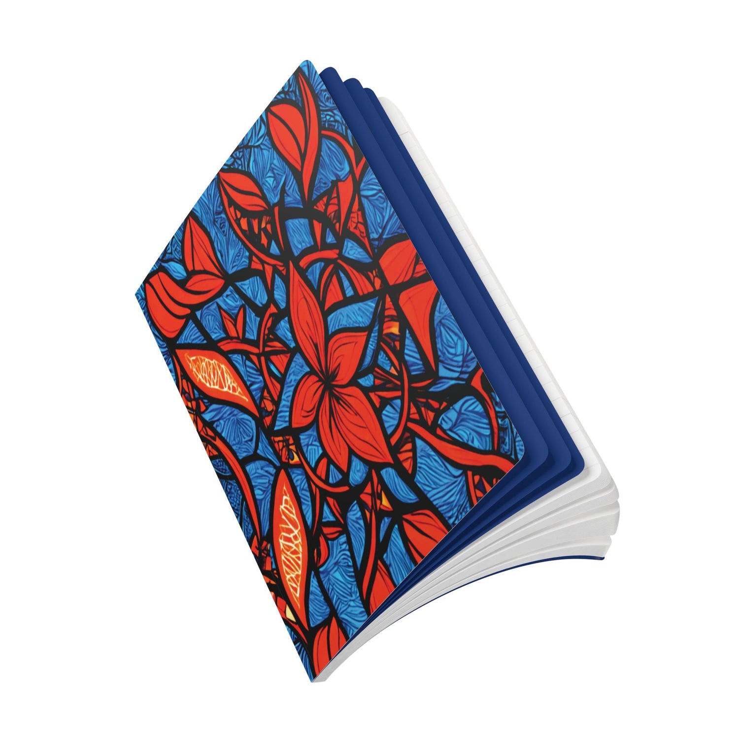 A notebook with a vibrant cover featuring bold red flowers and orange accents on a blue leafy background; the book is partially open, showing white pages inside.
