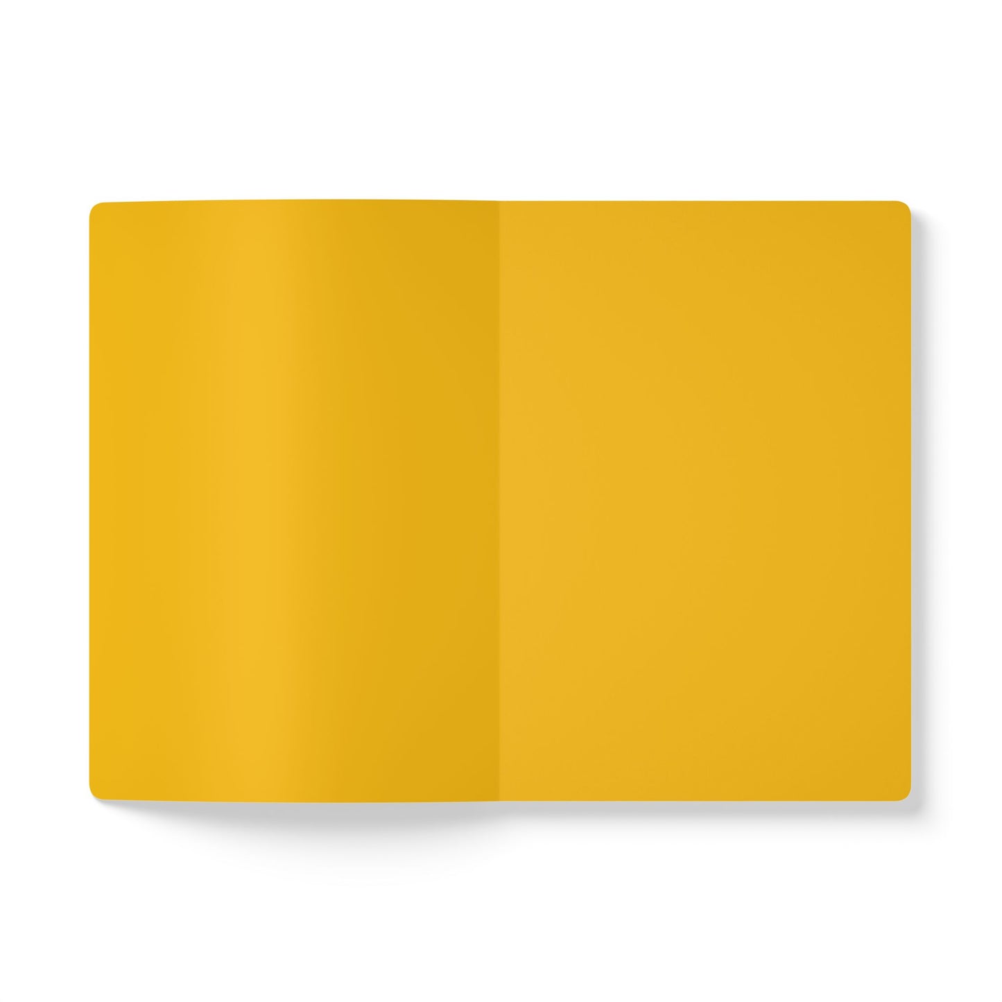 An overhead view of an open creative notebook with blank, bright yellow pages. Centered on a white background, this notebook is perfect for daily journaling, with a soft light casting a gentle shadow at the bottom left edge.