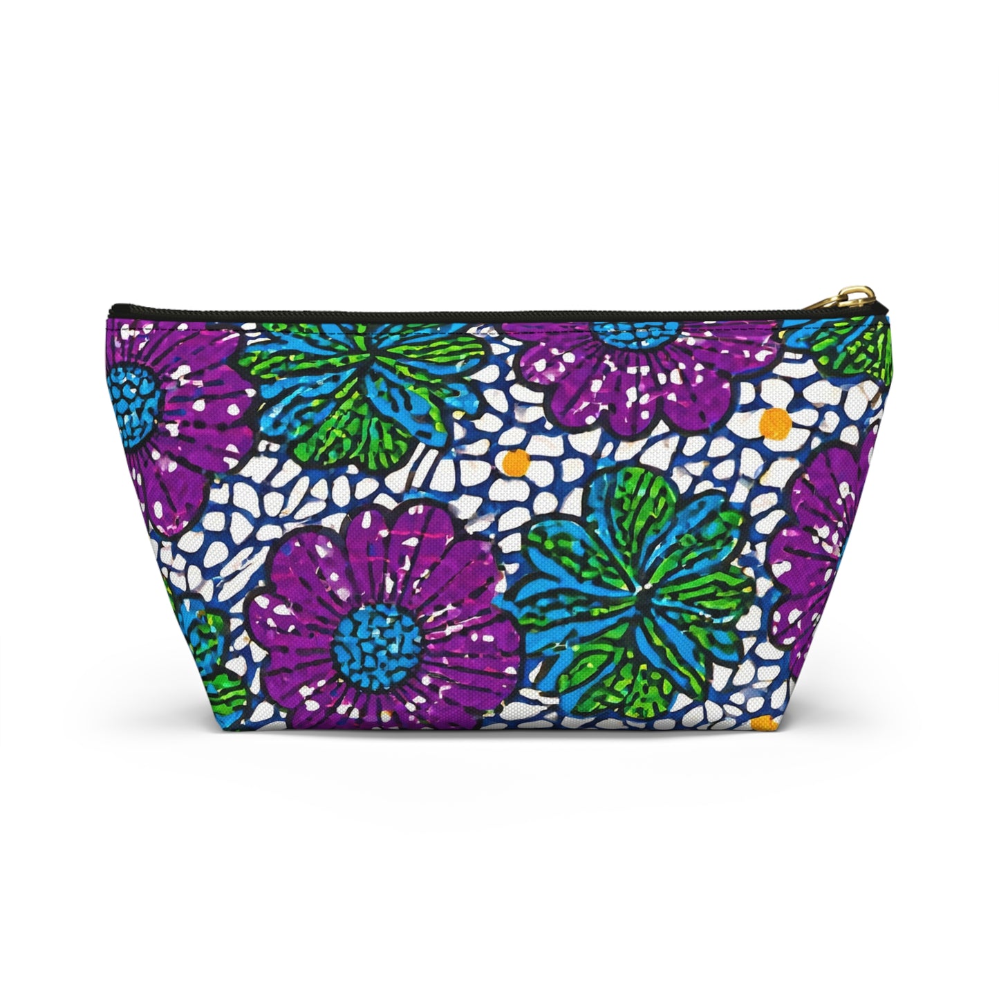 A zippered cosmetic travel bag featuring a vibrant floral pattern with large purple and green flowers, yellow dots, and white lace-like accents on a blue background. This T-bottom pouch stands upright and displays subtle African-inspired patterns.