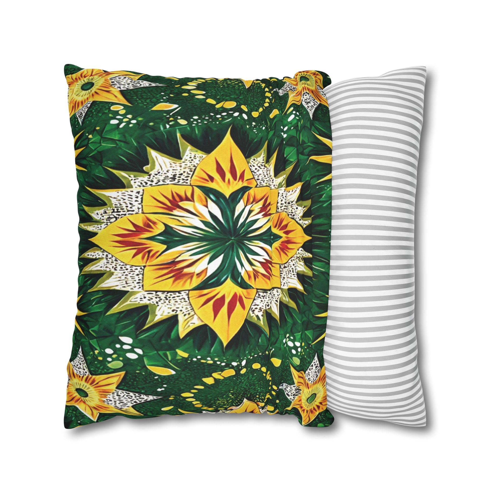Two pillows are shown: one with a vibrant, symmetrical floral and leaf pattern inspired by African pillowcases in yellow, green, orange, and white; the other with a simple white and gray horizontal stripe design. Both rest side by side on a white background.