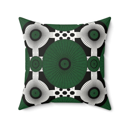 This green and black throw pillow features a bold geometric pattern with a large green central circle, white radiating lines, and black polka dots—an eye-catching African accent pillow crafted in soft faux suede for modern style.