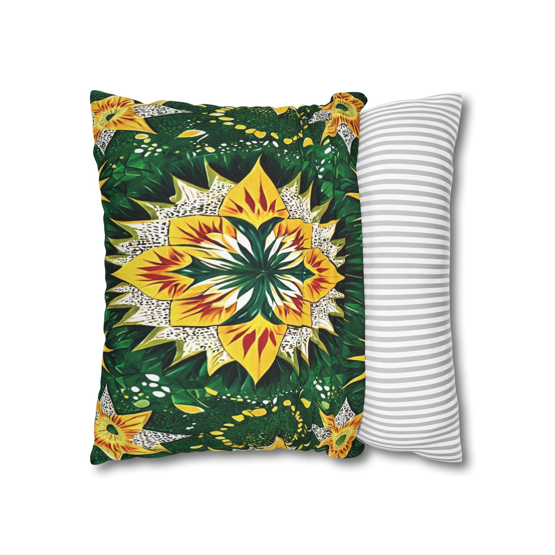 Two pillows overlap: the front pillow showcases a vibrant, symmetrical floral pattern with yellow, green, and orange hues inspired by African pillowcases; the back pillow is white with simple, evenly spaced horizontal gray stripes. Both are set against a white background.