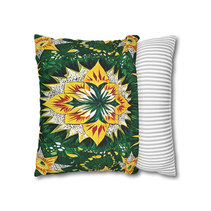 Two pillows overlap: the front pillow showcases a vibrant, symmetrical floral pattern with yellow, green, and orange hues inspired by African pillowcases; the back pillow is white with simple, evenly spaced horizontal gray stripes. Both are set against a white background.