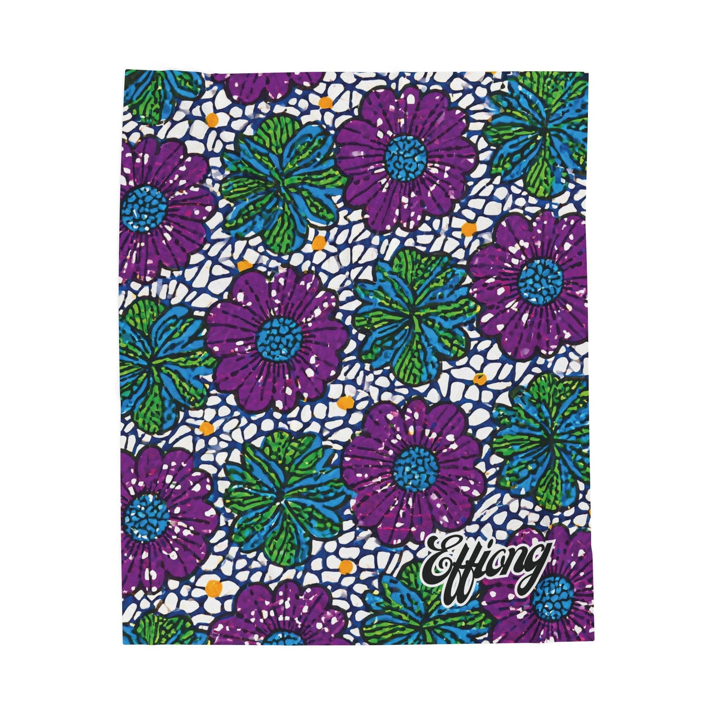 A vibrant, African-inspired blanket features bold purple flowers with blue centers and green leaves on a white background with blue and orange dots. The word Effiong appears in white script at the bottom right corner—a stunning custom gift.