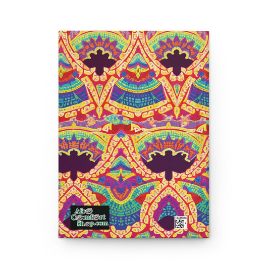 A brightly colored African-inspired hardcover journal cover with a symmetrical, abstract pattern in red, yellow, blue, and purple. The vibrant design features repeating arch shapes and floral motifs. “AfroComiXArtShop.com” logo and QR code appear in the lower-left corner.