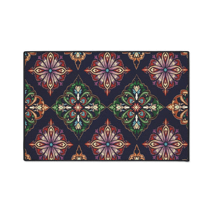A rectangular custom floor mat featuring an ornate, African-inspired floral and diamond pattern in vibrant shades of purple, orange, green, and blue on a dark navy background; non-slip rubber backing ensures it stays securely in place.