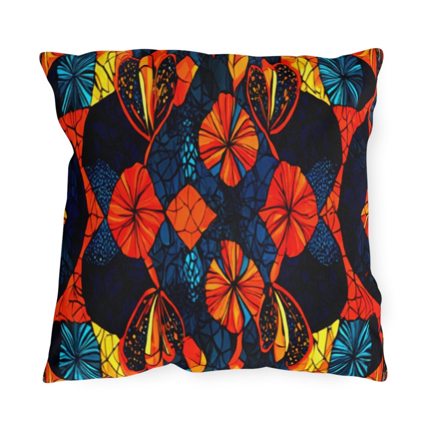 Square throw pillow with a bold, symmetrical pattern in vibrant orange, yellow, blue, and black. This UV-resistant outdoor pillow features floral and leaf-like shapes, resembling stained glass or batik for a lively and colorful decorative look.