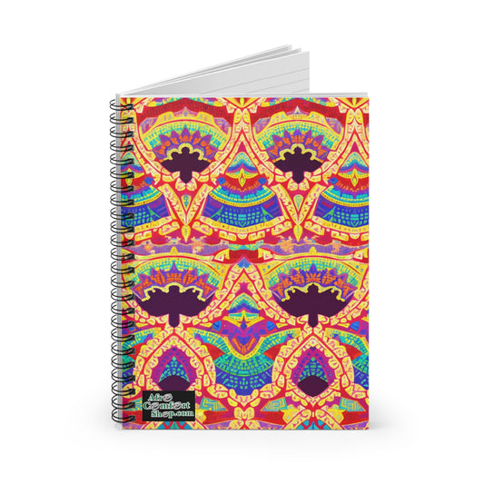 A spiral notebook featuring a vibrant, African-inspired symmetrical pattern in red, yellow, purple, and blue. The ornate abstract design covers the front cover, with a small black Alex Gabriel Shop.am label. Enjoy a premium writing experience on plain white pages.