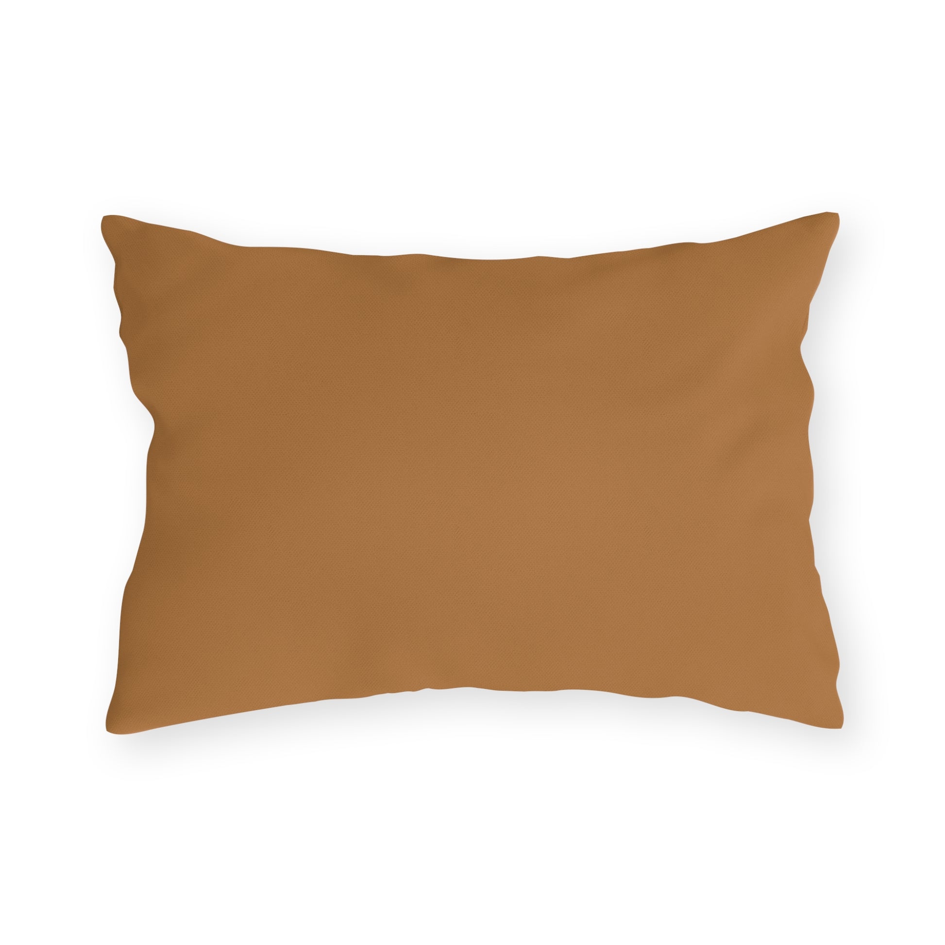 A rectangular, light brown outdoor pillow with a smooth, solid cover is shown against a plain white background. The pillow’s edges are slightly wrinkled, and its surface appears soft and plush.