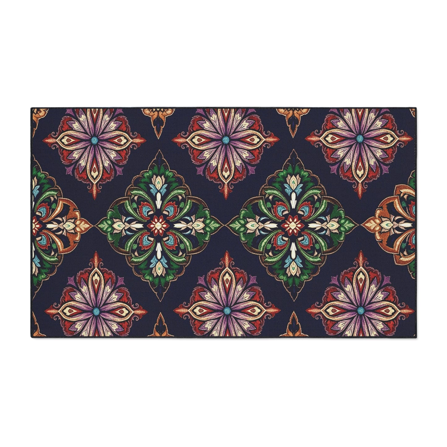 A rectangular rug with a dark navy background displays a repeating ornate pattern of stylized, symmetrical floral motifs in green, red, orange, and purple hues, arranged diagonally—featuring African-inspired aesthetics for unique flair.