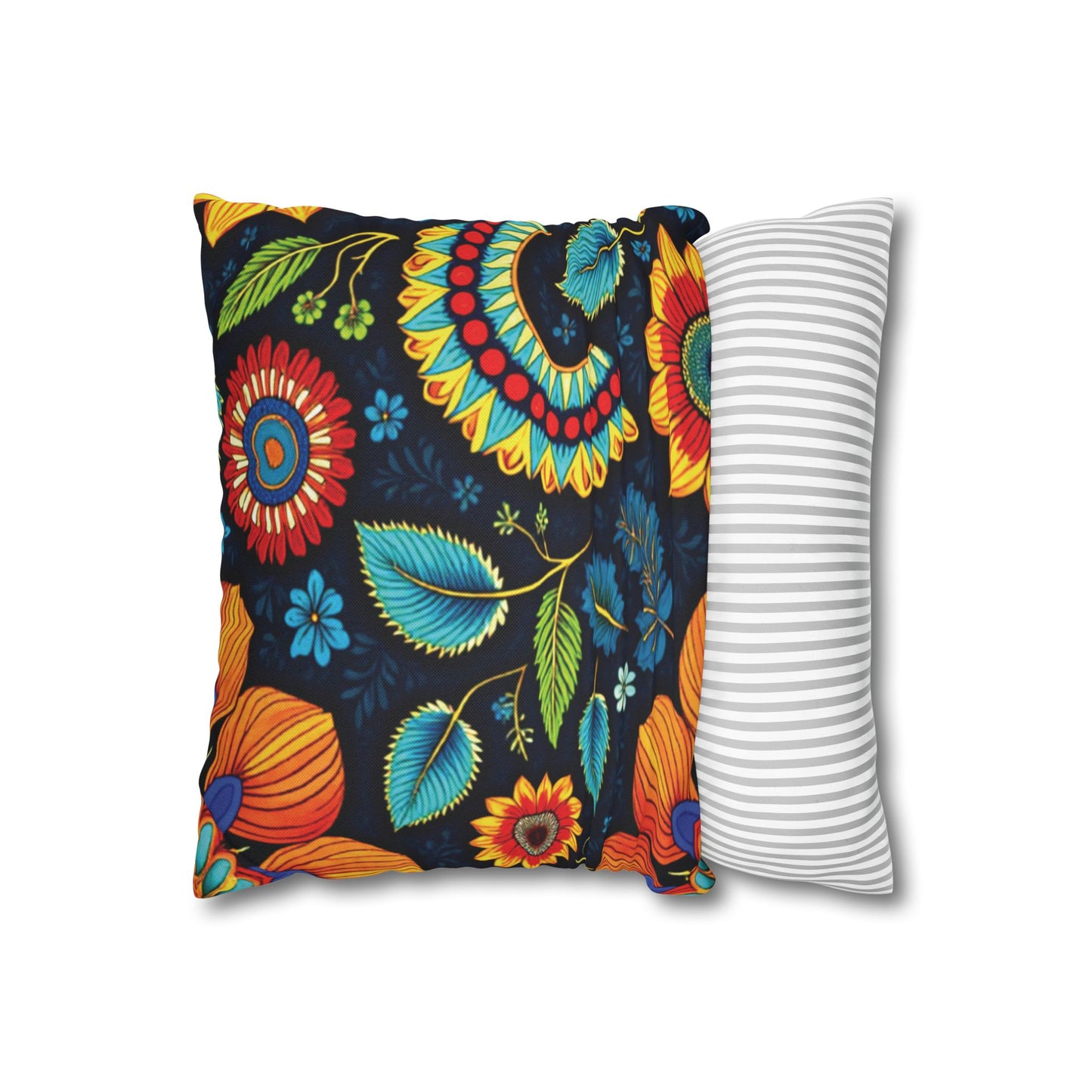Two square pillows side by side: one features African-inspired patterns with a vibrant floral design in orange, teal, yellow, and red on black; the other showcases gray and white horizontal stripes. Both are set against a plain white backdrop.