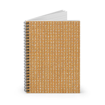 A premium writing journal stands upright with its cover facing forward. The cover features a textured pattern resembling woven burlap in tan and beige hues. The notebook’s white lined pages are partially open and visible at the top.
