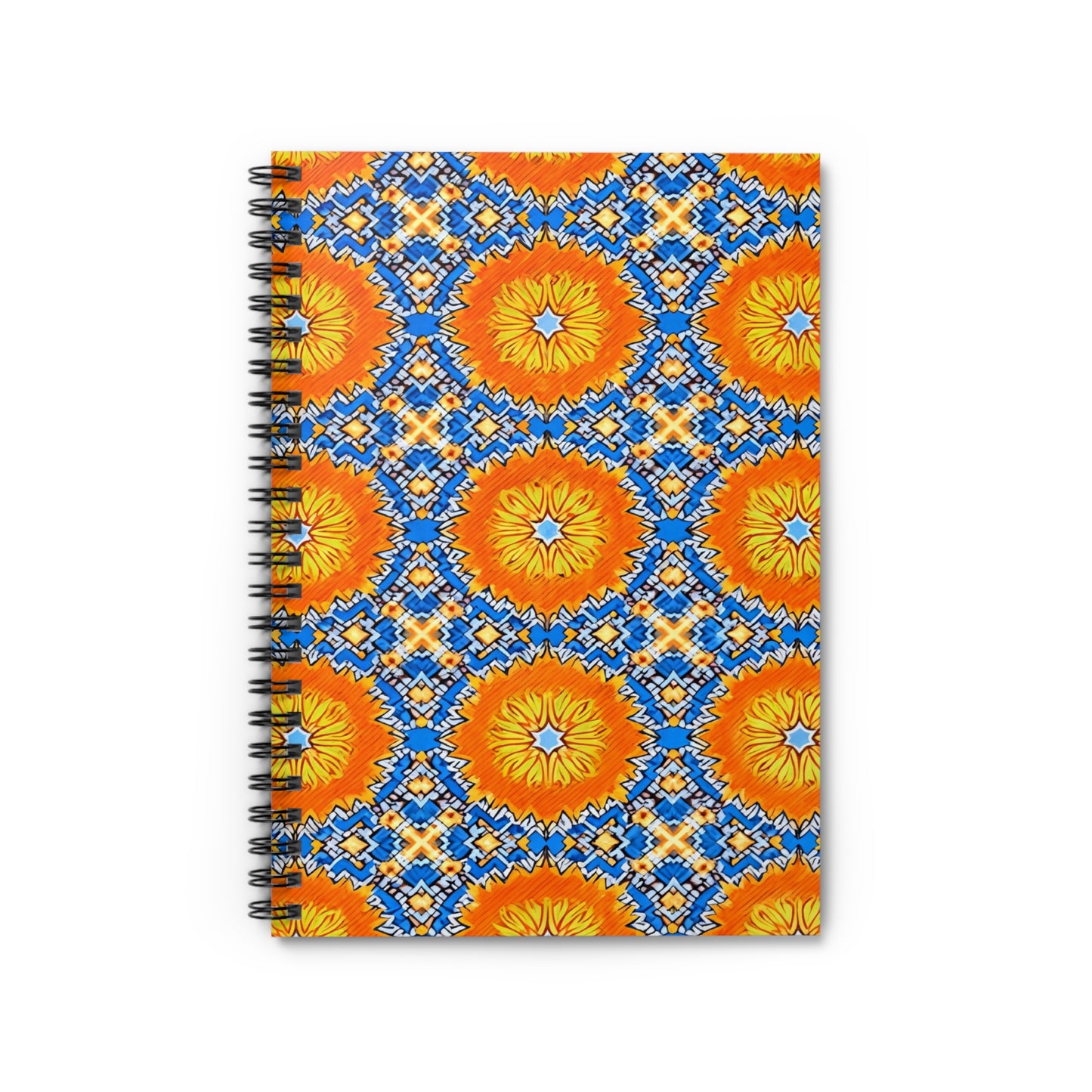 A vibrant designs notebook, this spiral-bound journal features a geometric cover with bold orange and yellow starbursts and blue, white, and orange diamonds on white. The African-inspired spiral notebook is displayed vertically on a white surface.