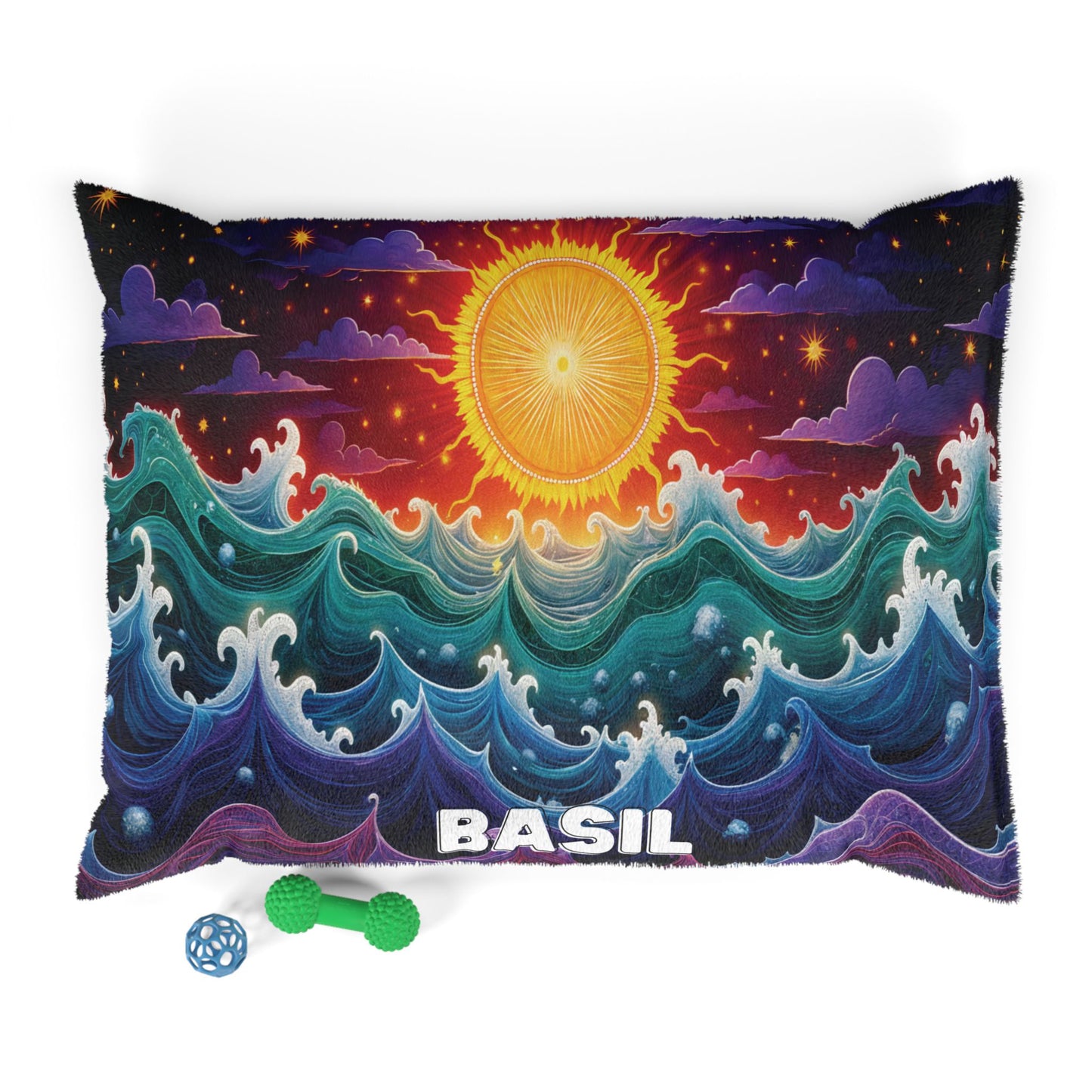 A rectangular pillow with a vibrant design of swirling ocean waves, a radiant sun, and BASIL written in bold white letters at the bottom. Enjoy luxurious comfort with durable construction, plus two dog toys: a green bone and a blue lattice ball nearby.