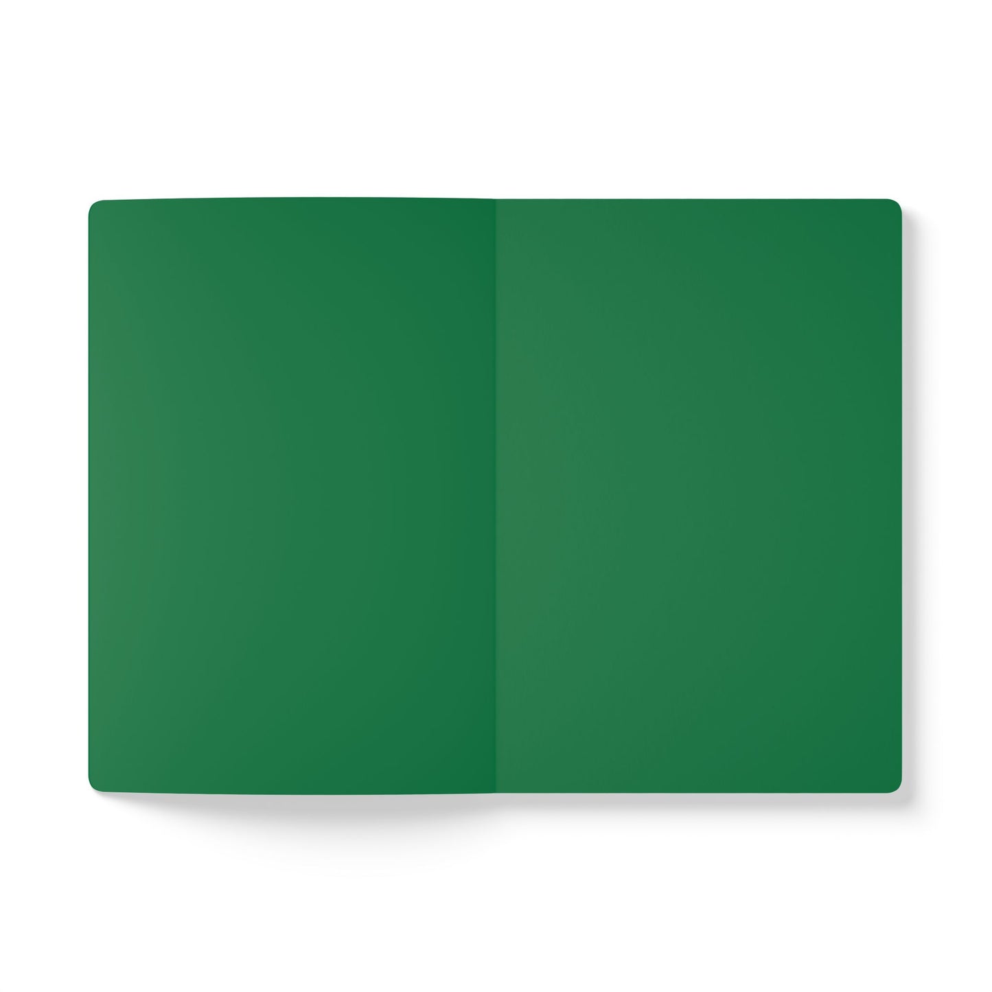 An open African-inspired journal lies flat on a white surface. Both visible pages are completely blank and solid dark green in color, with a subtle crease running vertically down the center where the notebook is folded.