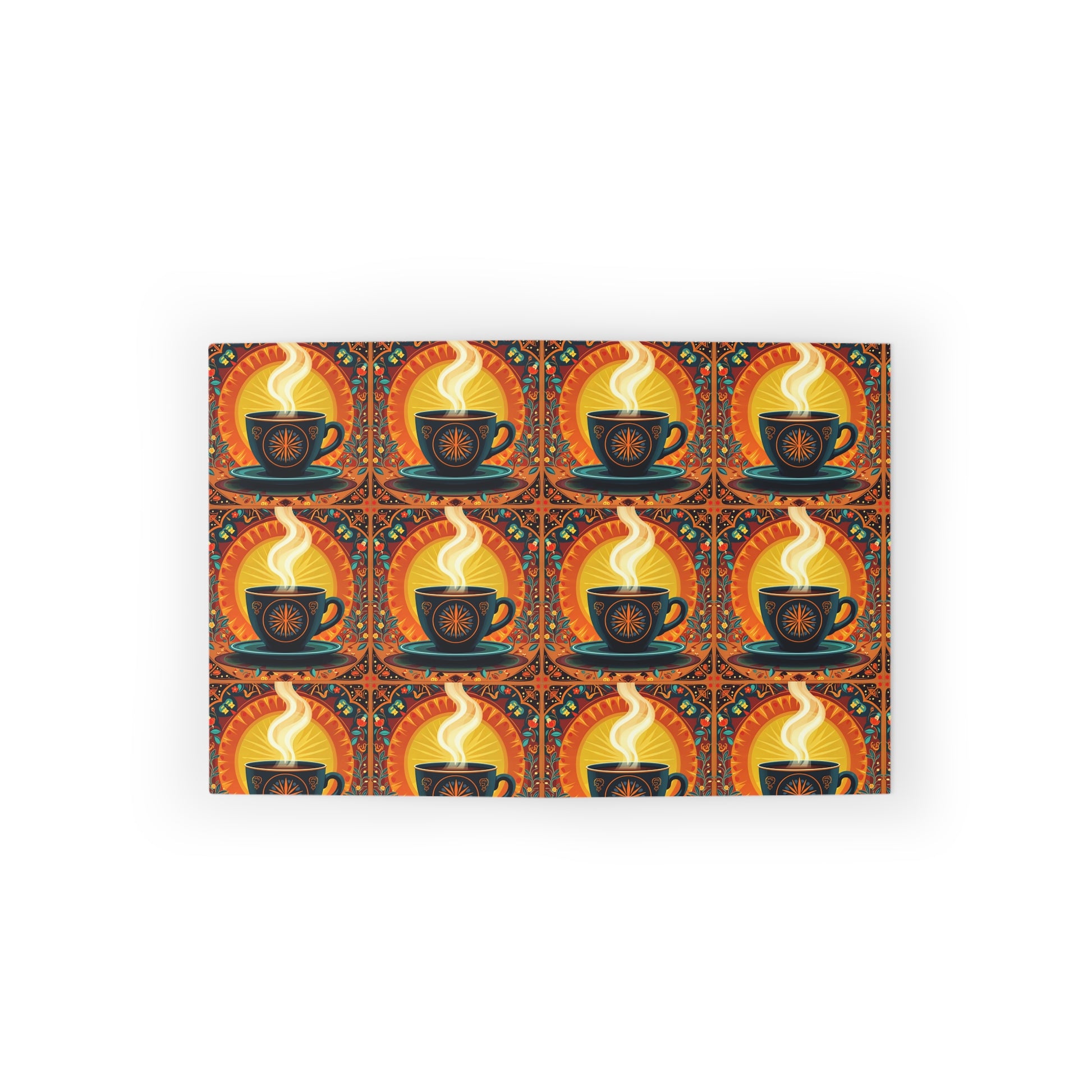 A rectangular mat features a repeating pattern of black coffee cups with swirling steam, set against a warm orange and yellow background with decorative accents. The symmetrical, vibrant design evokes a cozy, vintage feel inspired by culturally inspired designs.