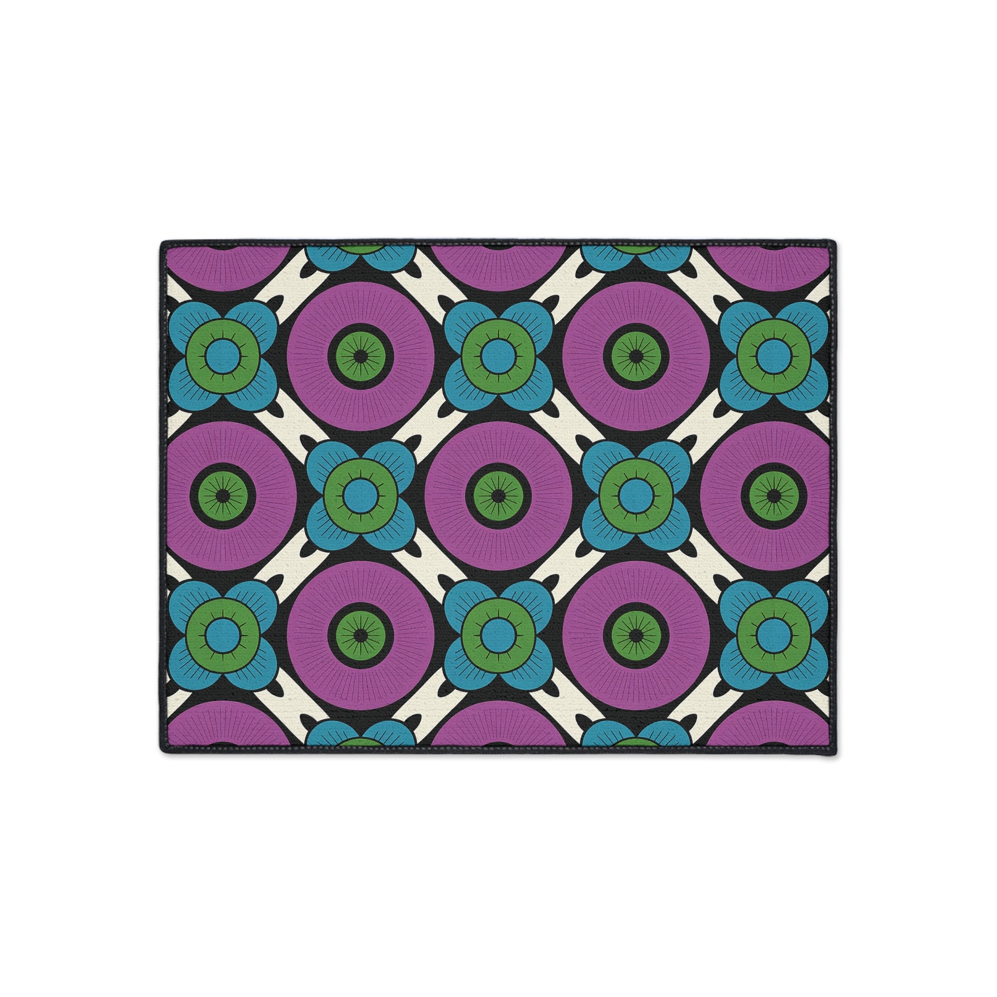 Rectangular rug with a bold, repeating geometric floral pattern inspired by African-inspired aesthetics. Purple circles with green centers, blue petaled flowers, and black outlines sit atop a white background—plus non-slip backing for secure placement.