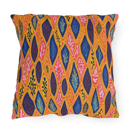 Square pillow with a vibrant, African-inspired pattern of leaf shapes in blue, pink, yellow, and orange. The leaves are outlined in yellow on a warm background, creating a lively, colorful, and modern botanical design.