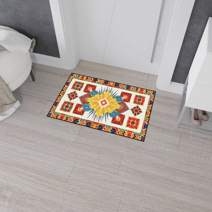 A colorful rectangular rug with African-inspired geometric, star, and diamond patterns in red, orange, yellow, blue, and white sits on a light gray tile floor near a door. It features a non-slip rubber backing for added safety.