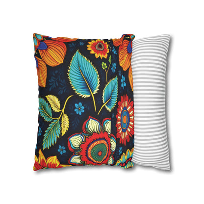 Two pillows overlap on a white background. The left pillow showcases vibrant African patterns with large, colorful flowers and leaves on black, while the right features a simple design of thin, horizontal grey and white stripes.